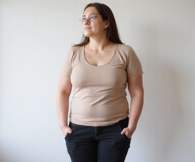 Person looking slightly unhealthy or overweight before transformation